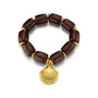 Dark brown beaded bracelet with gold shell charm and metallic spacers